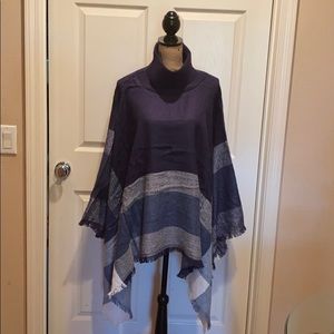 Turtleneck pullover poncho in navy.